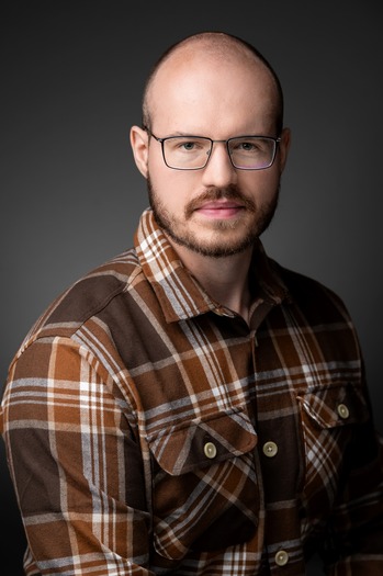 Headshot of Lee Hristienko who passed Qualifying Paper
